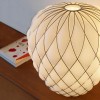 lampe de Table Pinecone cage chromée verre blanc Fontana Arte Valente Design Paola Navone sur table vue de près