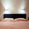 Applique Falena FontanaArte Valente Design en lampe de chevet