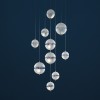 Suspension Postkrisi Chandelier Catellani and Smith Valente Design éclairée