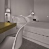 Applique Melampo Wall with switch gris abat-jour gris Artemide - Valente Design éclairée en tête de lit