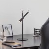 Lampe de table Magneto noir Foscarini - Valente Design éclairée sur bureau