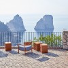 Fauteuil CARA OUTDOOR ROUILLE/FIBRE TEINTÉE BLEU-ORANGE Kartell - Valente Design - sur terrasse