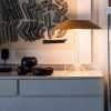 Lampe de table Chapeaux M ocre Foscarini  - Valente Design - éclairée sur meuble