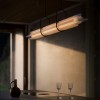 Suspension NL12 DCW Editions - Valente Design - éclairée au dessus d'une table de salle à manger