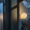 Lampe à poser Hoba - Foscarini - Valente Design - éclairée dans couloir