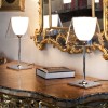 2 lampes de table Ktribe T1 Glass sur un buffet posées devant un miroir - Flos - Valentedesign.com