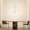 Suspension Axia black chrome au-dessus d'une table à manger avec deux chaises en intérieur - Lodes - Valentedesign.com