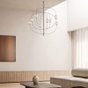 Suspension Axia glossy bronze au-dessus d'une table basse et d'un canapé en intérieur - Lodes - Valentedesign.com
